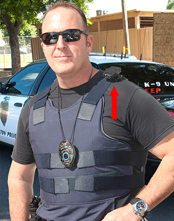 Vice police officer wearing bullet proof vest and wearing body camera